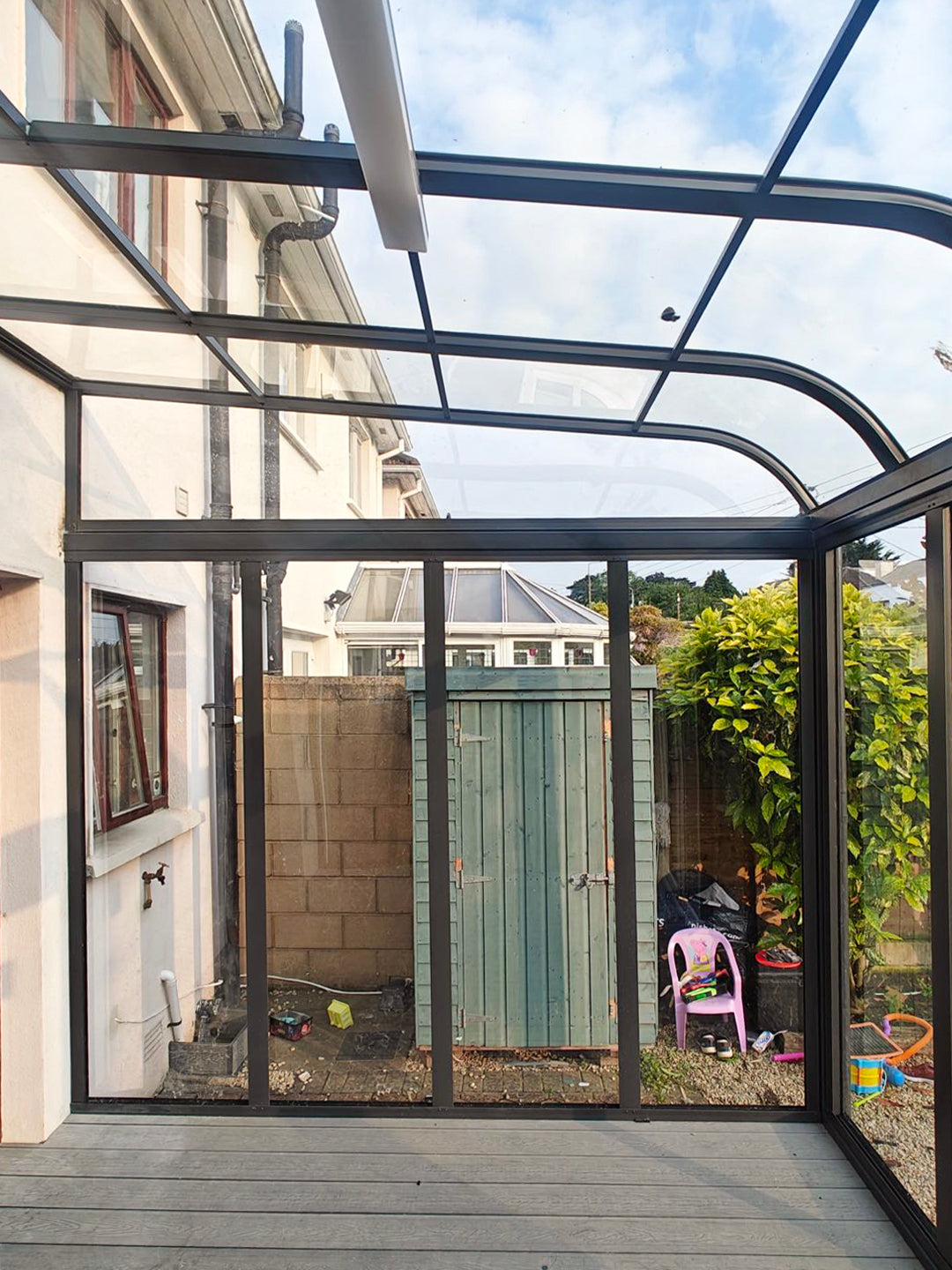 Aluminium canopy with decking and side walls
