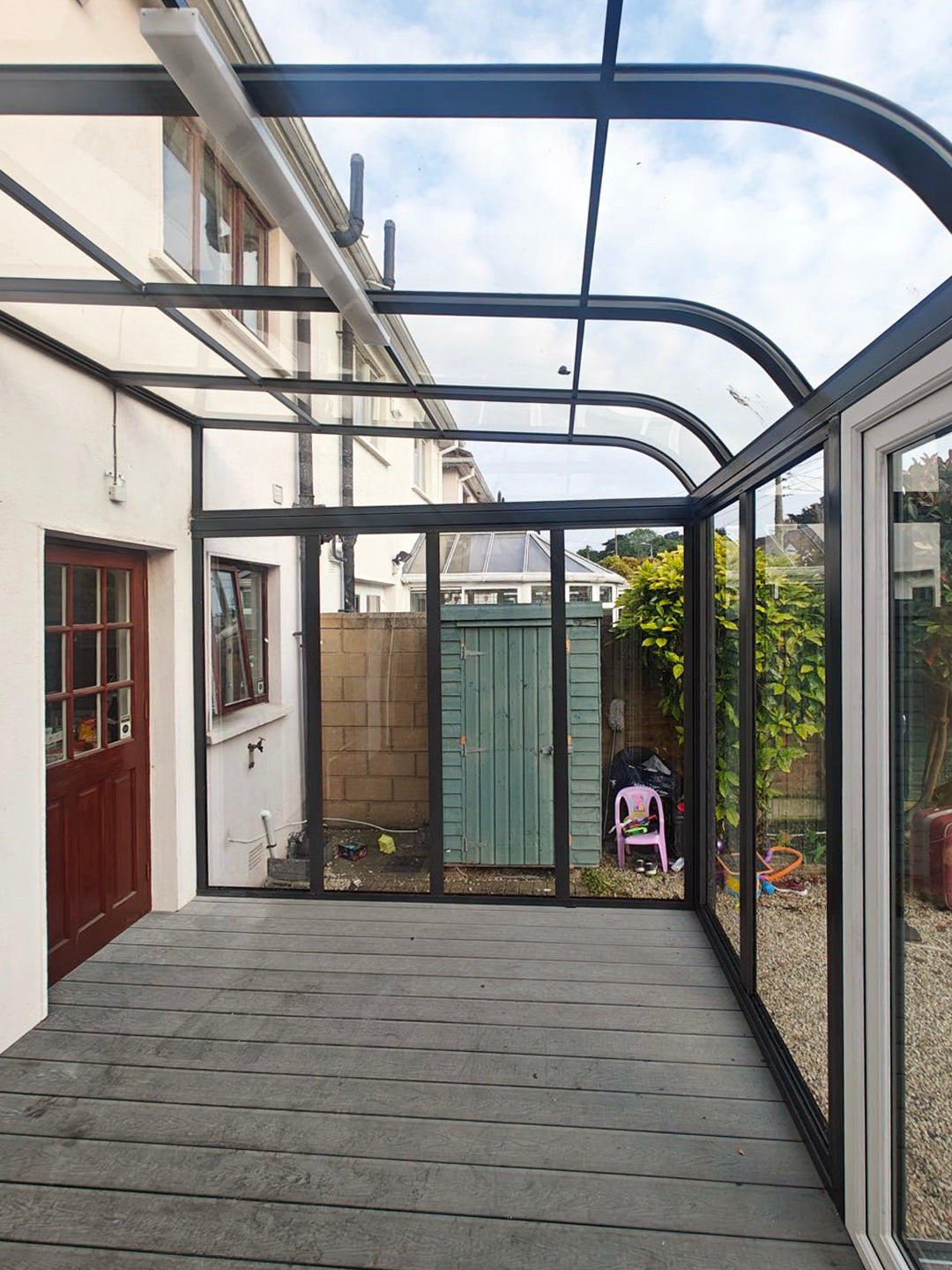 Aluminium canopy with decking and side walls